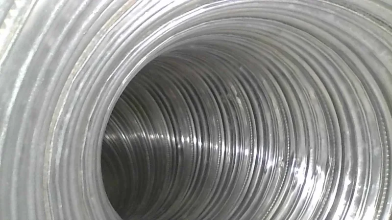 Inside a cleaned dryer duct, looking down bare spiral metal
